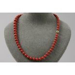 vintage necklace with one string of 63 beads in Mediterranean red coral & with a lock/in yellow gold