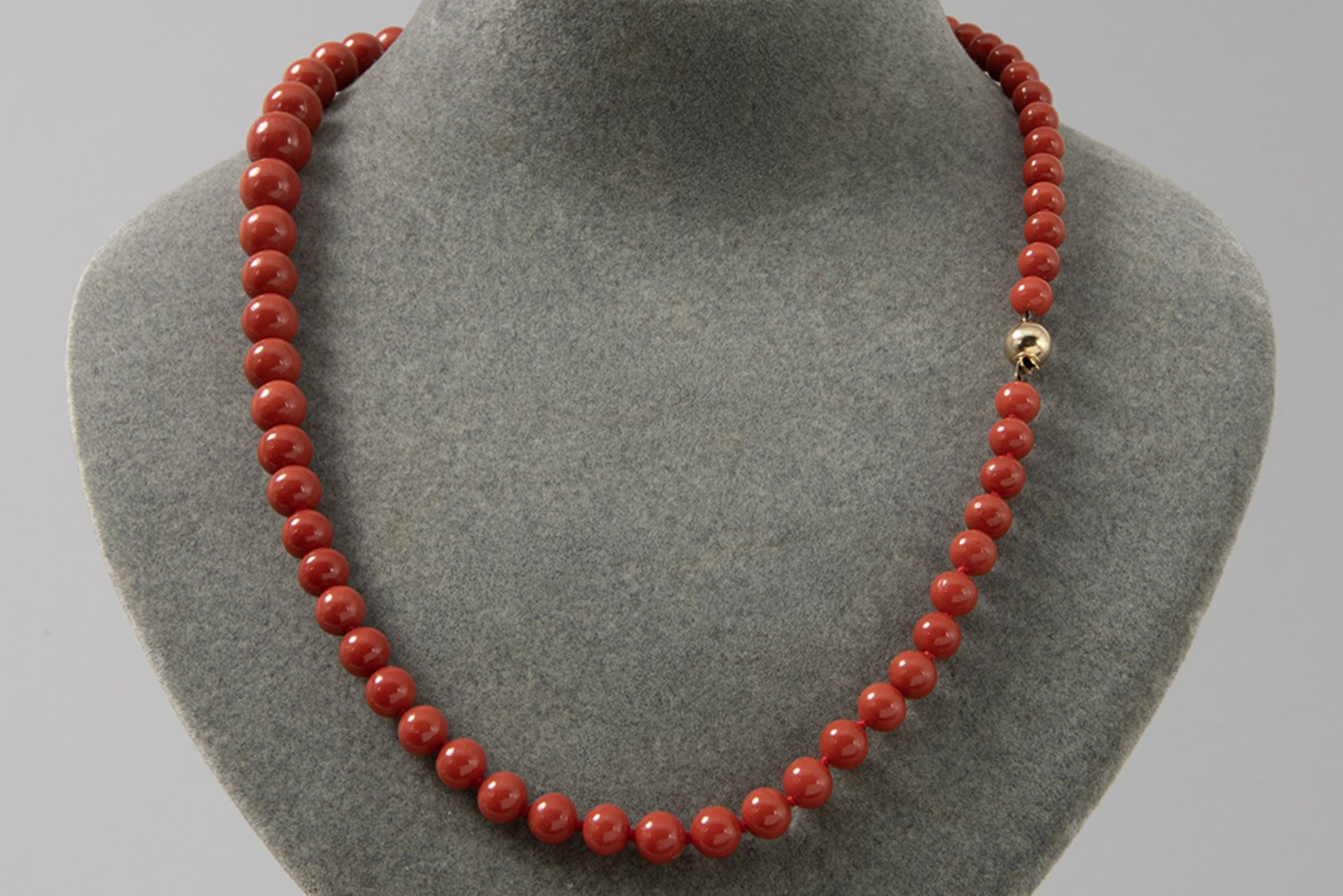 vintage necklace with one string of 63 beads in Mediterranean red coral & with a lock/in yellow gold