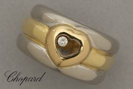 Chopard signed, marked and numbered "Happy Diamonds" ring in yellow and white gold (18 carat) with a