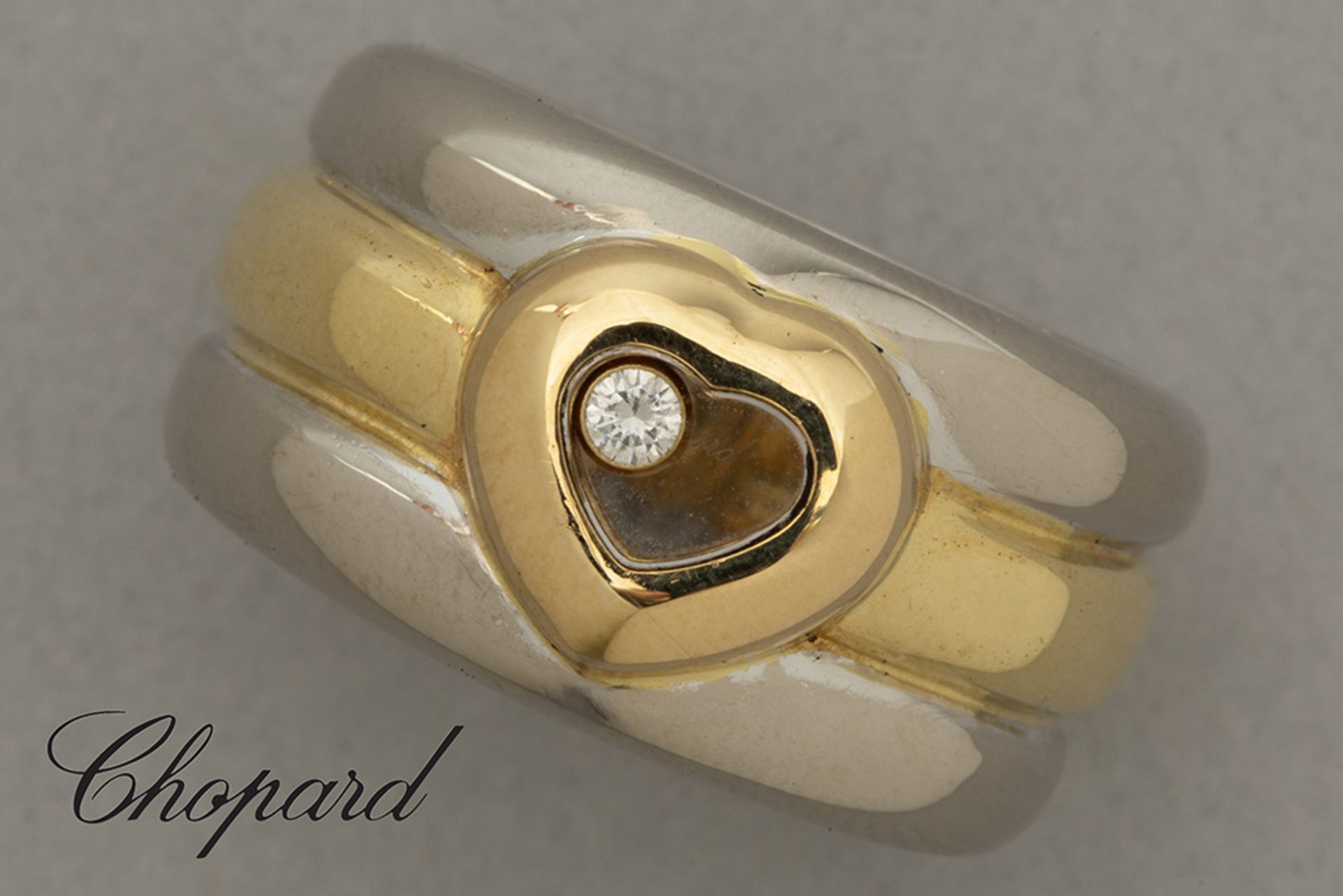Chopard signed, marked and numbered "Happy Diamonds" ring in yellow and white gold (18 carat) with a