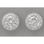 pair of earrings in white gold (18 carat) with two bigger very high quality brilliant cut diamonds (