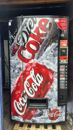 COKE VENDING MACHINE COLD DRINKS CANS AND BOTTLES
