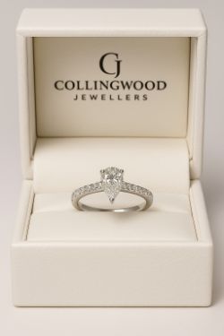 0.72CT TOTAL, PEAR SHAPED DIAMOND ENGAGEMENT RING/ DIAMOND SHOULDERS WHITE GOLD+AGI-BOX