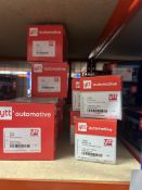 Contents of rack to include various quantities of YTT shock absorber mounts, engine mounting, tie