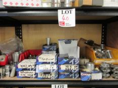 Contents of shelf to include various soft jaws and brass fittings