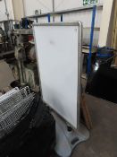 An Advertising Board and Wooden A-Frame