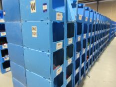 Large quantity of assorted clothing to part row W (including corrugated pigeon holes)