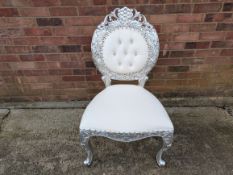 Ornate Silver chair Approximate dimensions: Width 64cm, depth 54cm, seat height 48cm, total height 1