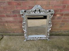 Silver Framed mirror. Height 84cm, width 64cm