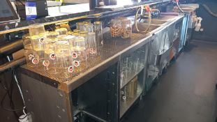 Stainless steel bar section with ice well, sink, bottle shelf and shelving under (purchasers’