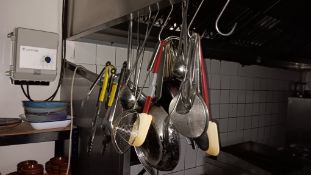 Assortment of cookware and utensils – Located in the kitchen