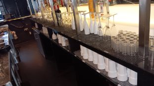 Quantity of assorted glassware to bar area, branded and unbranded – Located behind the bar