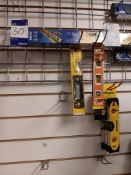 Quantity of quickclamps and spirit levels to wall