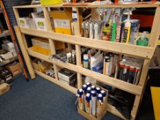 Large quantity of silicone, mastic, grease, resin, foam and applicators to wooden display stand