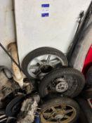Quantity of various used motorcycle wheels & tyres & engine parts to floor