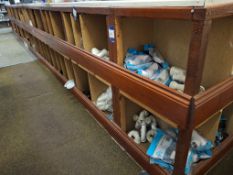 Contents of cubby holes under counter to include various pipe connectors, clips, drain pipe