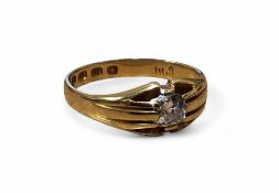 A late Victorian 18ct gold and diamond solitaire gypsy ring, set with an old cut round diamond,