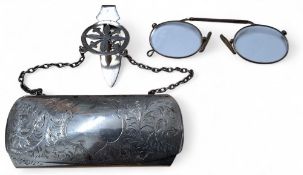 A silver chatelaine spectacle case, chain and clip, the case chased and engraved with scrolls,
