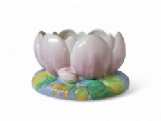 A Clarice Cliff lily pad jardiniere, modelled as an open pink flower on green foliage, 23cm wide,