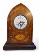 An Edwardian mahogany arched mantel clock, 6.5cm enamelled dial with blue Roman numerals, single