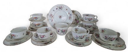A Minton Marlow pattern tea service, for eight, comprising cups, saucers, side plates, bread and