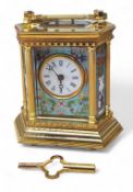 A cloisonne enamel brass-cased hexagonal carriage clock, enamelled dial and Roman numerals,