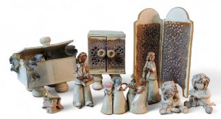 An Art Pottery stoneware model, of an open chest, overflowing with leaves, 16cm high, 15cm wide,