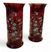 A pair of ruby glass cylindrical vases, with slightly flared rim, printed with butterflies and