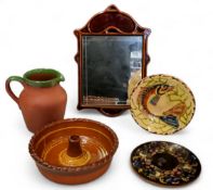 An unusual brown treacle glazed pottery shaped rectangular mirror, 34cm high, 22cm wide, c.1880;   a