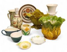 A Bretby jardiniere, in relief with leafy scrolls, in mustard and green, 22cm wide, 18cm high,