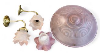 An Art Deco style pink moulded glass ceiling dome, 35cm diam;   a pair of brass wall lights, frilled
