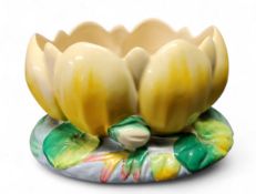 A Clarice Cliff lily pad vase, moulded as an open flowers, in tones of yellow, blue and green, 12.
