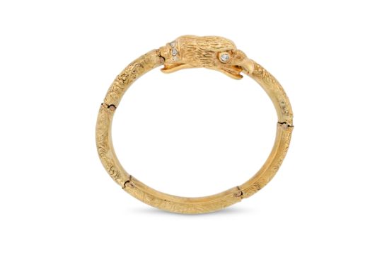 A RARE ANTIQUE DIAMOND EAGLE BANGLE, 19TH CENTURY in yellow gold, the articulated body in crossov...