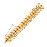 CHRISTIAN DIOR BY MITCHEL MAER, A VINTAGE BRACELET comprising a central row of red crystals,