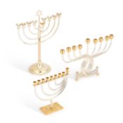 JUDAICA: THREE PARCEL-GILT METAL HANUKKAH MENORAHS
