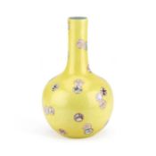 A CHINESE FAMILLE ROSE SGRAFFITO PORCELAIN BOTTLE VASE WITH A YELLOW GROUND