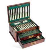 AN EARLY 20TH CENTURY BRASS-INLAID MAHOGANY CASED CANTEEN OF SILVER-PLATED CUTLERY