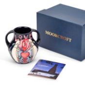 A MOORCROFT POTTERY TWO-HANDLED VASE