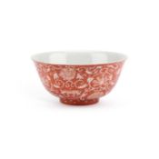 A CHINESE PORCELAIN BOWL WITH AN IRON-RED GROUND