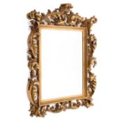 A LARGE BAROQUE STYLE GILT-COMPOSITION MIRROR
