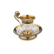 A FINE FRENCH EMPIRE SILVER-GILT MOUNTED GLASS CUP AND SAUCER