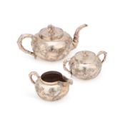 A CHINESE SILVER THREE-PIECE TEA SERVICE LATE 19TH/ EARLY 20TH CENTURY