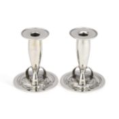 ARCHIBALD KNOX (1864-1933) FOR LIBERTY & CO, A PAIR OF TUDRIC PEWTER CANDLESTICKS