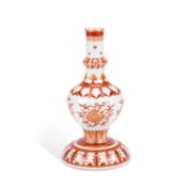 A CHINESE IRON-RED DECORATED HOLY WATER VASE