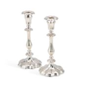A PAIR OF SILVER-PLATED CANDLESTICKS
