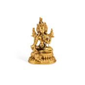 A SMALL TIBETO-CHINESE BRONZE FIGURE OF BUDDHA