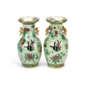A NEAR PAIR OF 19TH CENTURY CHINESE FAMILLE ROSE CELADON-GROUND PORCELAIN VASES