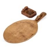 ROBERT THOMPSON OF KILBURN, A MOUSEMAN OAK CHEESEBOARD AND ASHTRAY