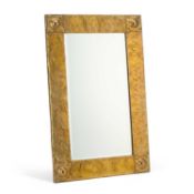 AN ARTS AND CRAFTS BRASS MIRROR