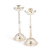A PAIR OF SILVERED METAL CANDLESTICKS IN THE SECESSIONIST TASTE